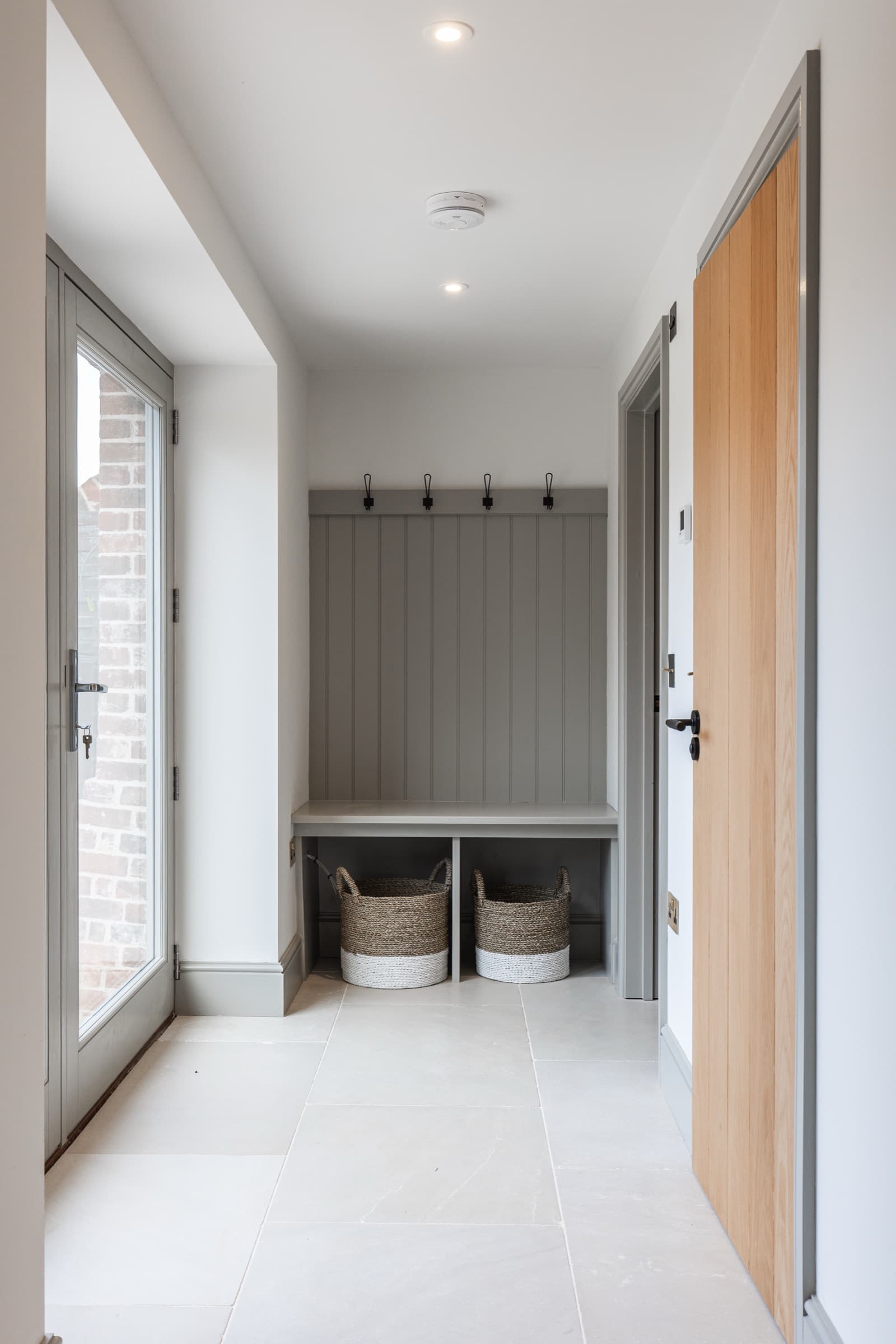 Boot room in a Wood Farm home